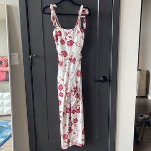 White jumpsuit with pink floral design